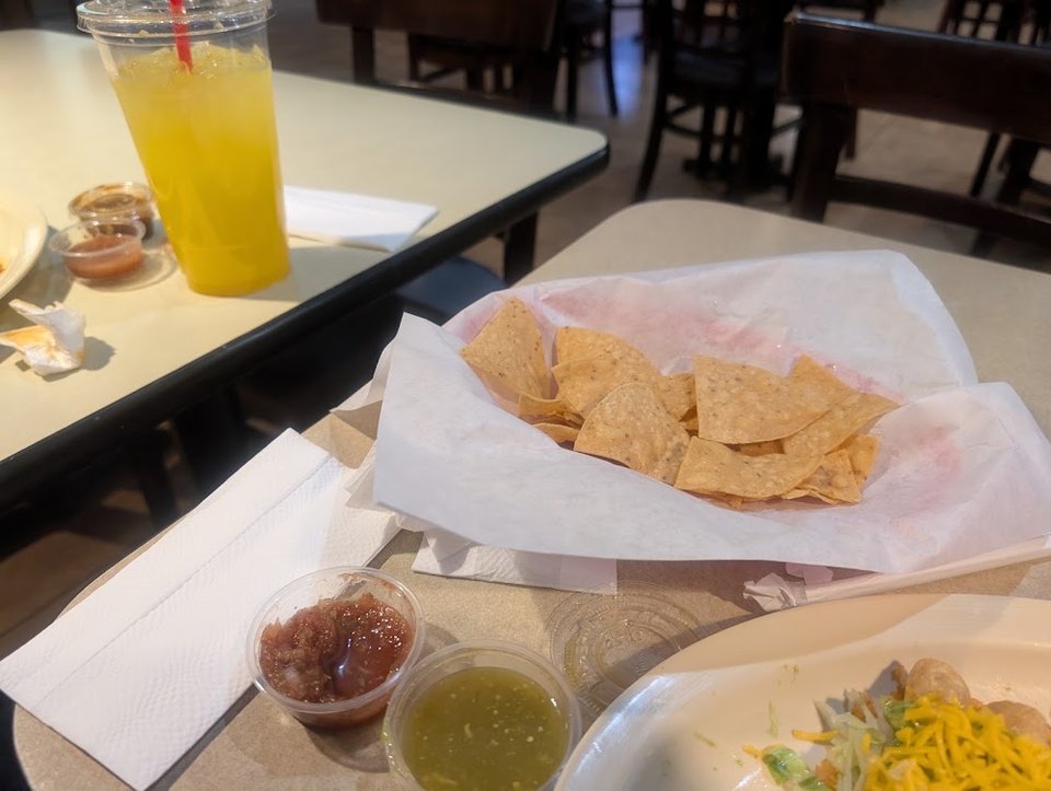 Menu board with tacos and tortas